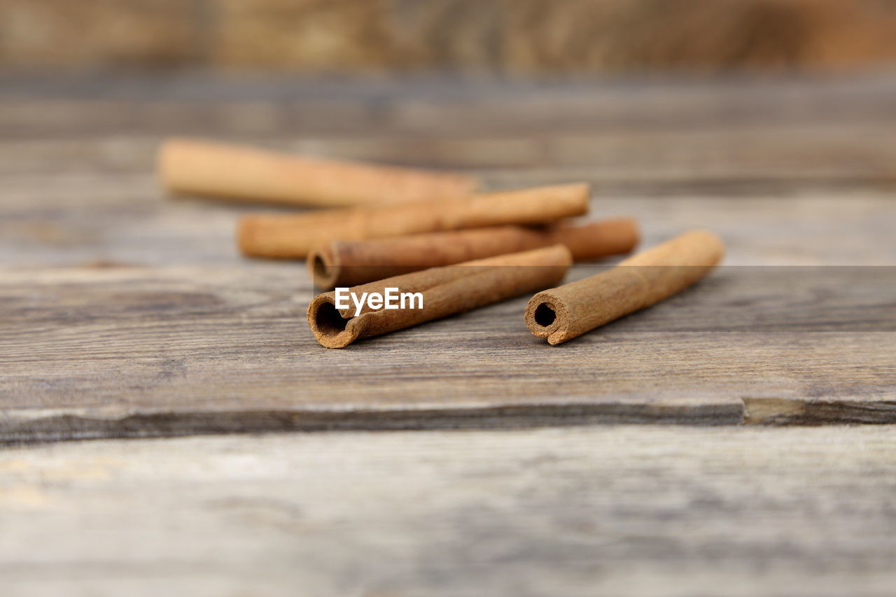 Close-up of cinnamons on table