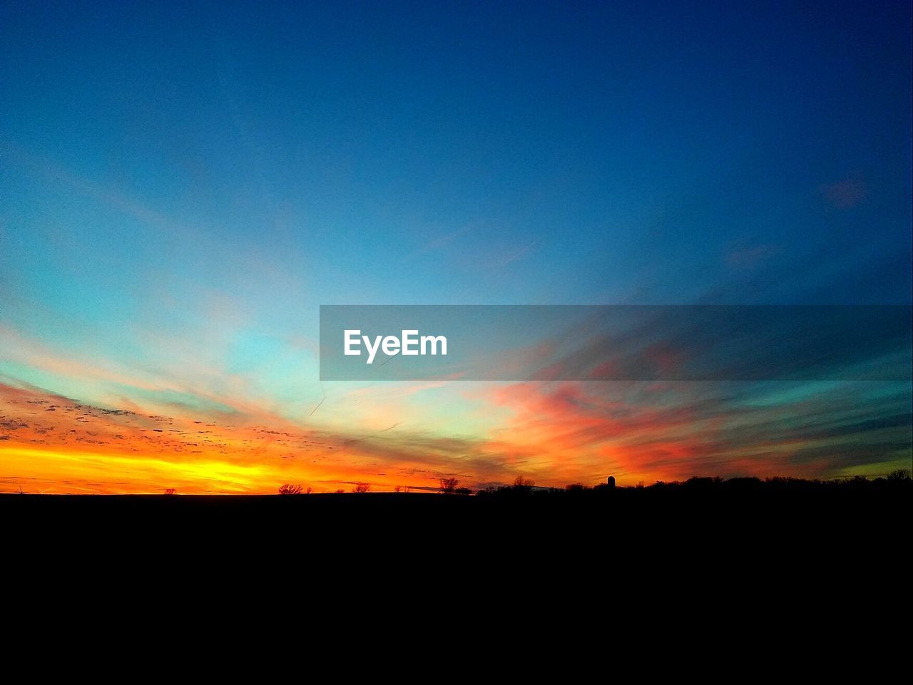 SILHOUETTE LANDSCAPE AGAINST SKY AT SUNSET