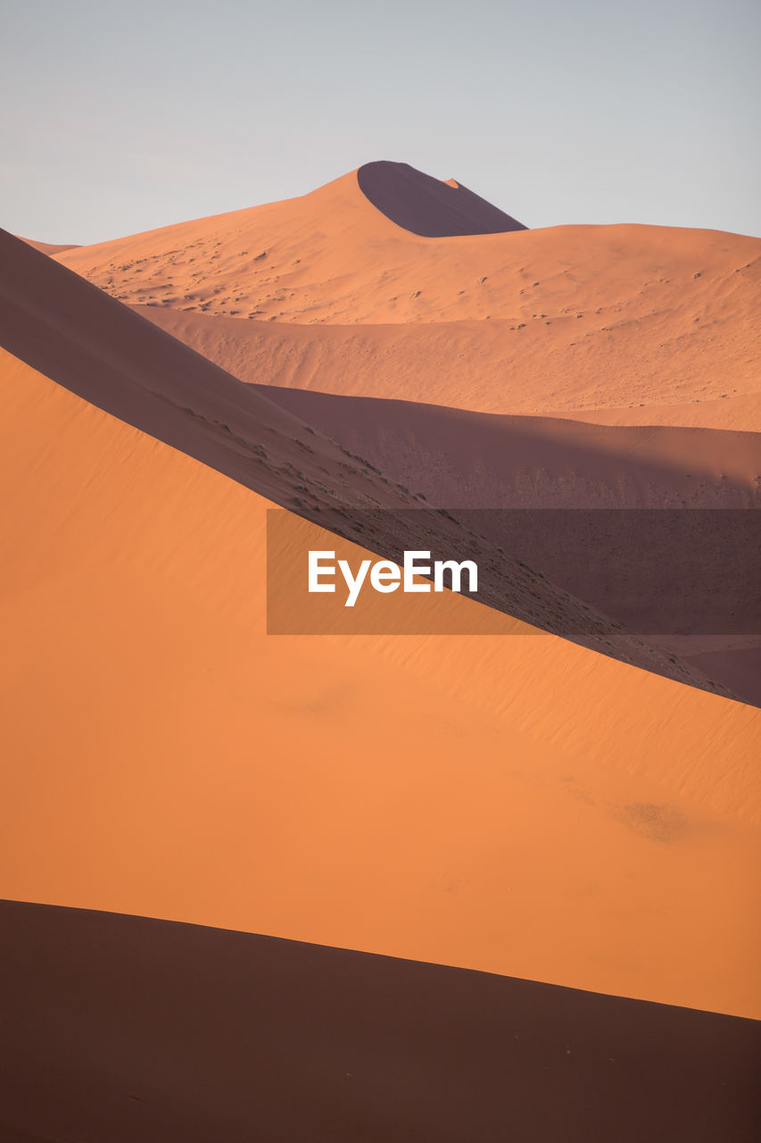 Scenic view of desert against clear sky