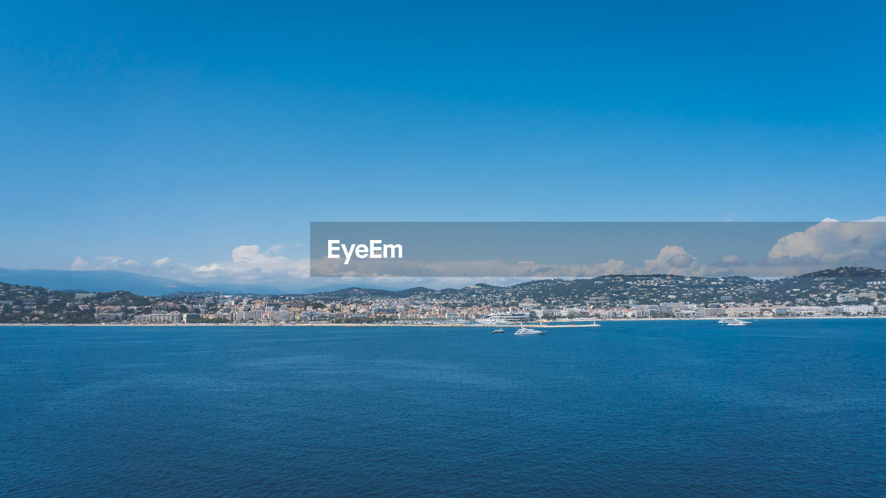 Scenic view of sea against blue sky