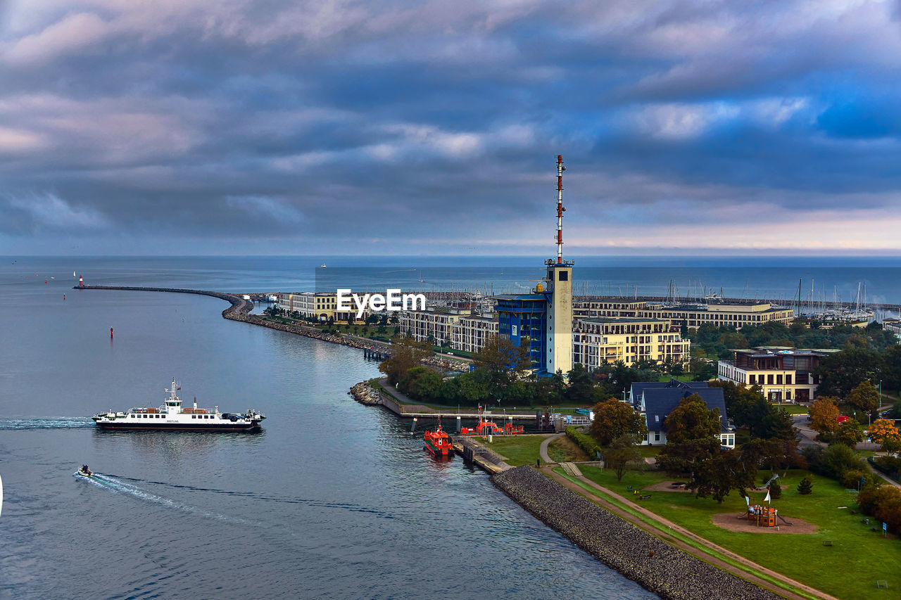architecture, water, built structure, building exterior, city, sky, travel destinations, transportation, building, cloud, travel, sea, nautical vessel, nature, tourism, landscape, cityscape, tower, coast, harbor, urban skyline, mode of transportation, environment, business finance and industry, land, beach, outdoors, high angle view, sunset, vacation, trip, holiday, horizon, dusk, industry, no people, the past, waterway, bay, history, vehicle, scenics - nature, street, beauty in nature, aerial view, city life, shore, blue, construction industry, business