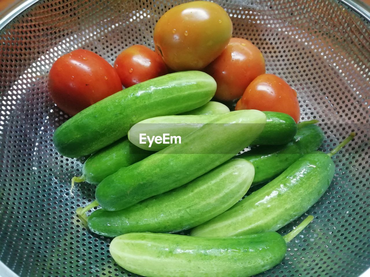 HIGH ANGLE VIEW OF FRESH TOMATOES WITH VEGETABLES