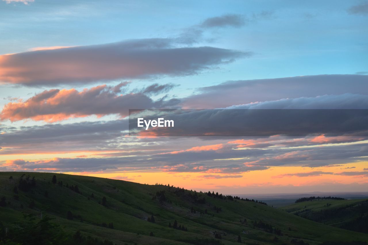 Scenic view of landscape against sky during sunset