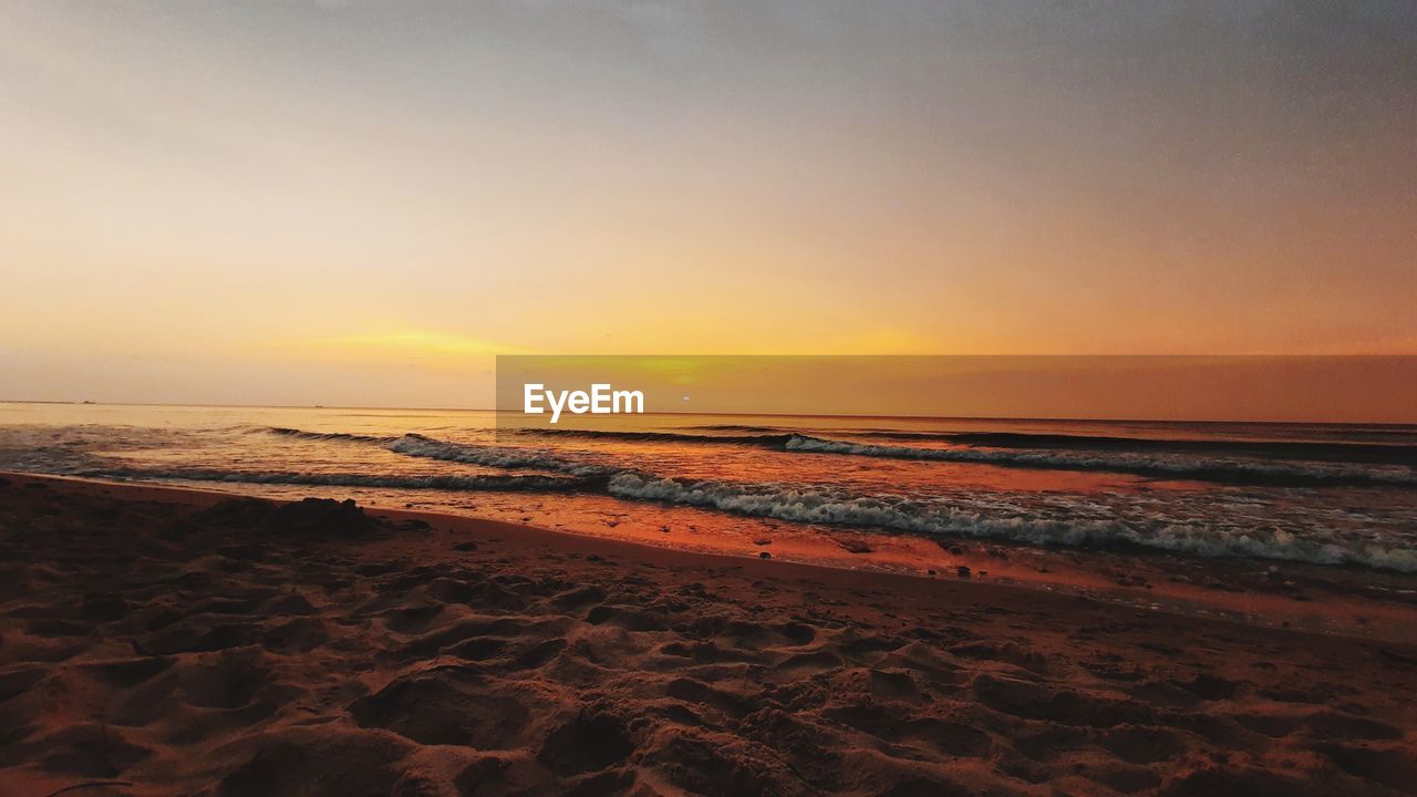 SCENIC VIEW OF SEA DURING SUNSET