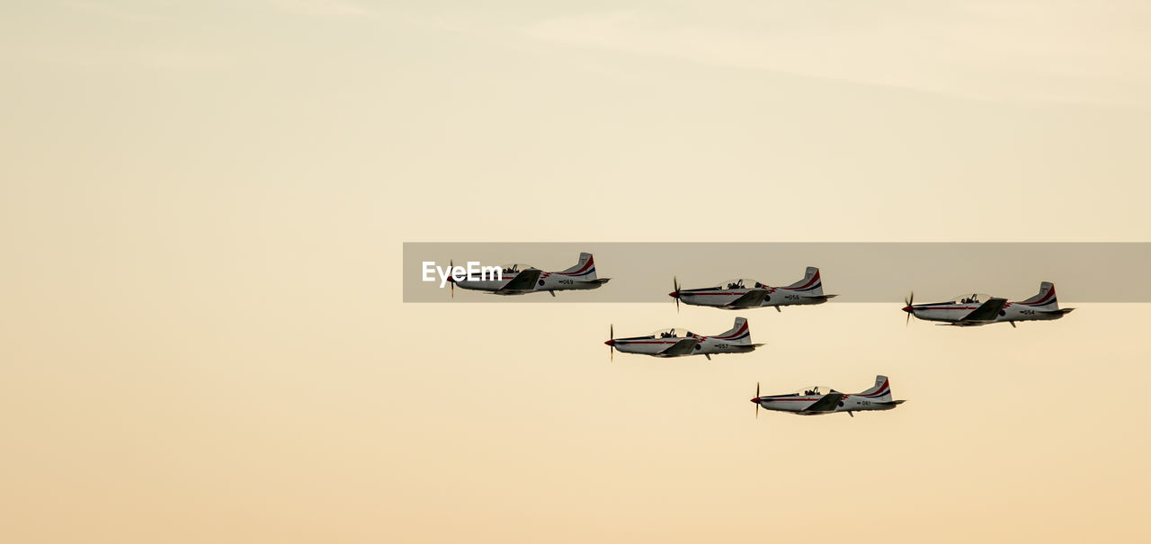 LOW ANGLE VIEW OF HELICOPTER AGAINST SKY