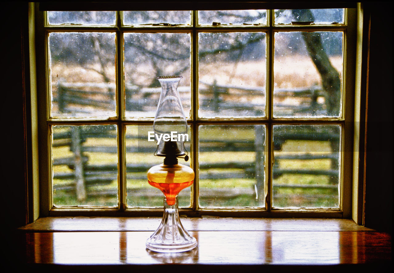 CLOSE-UP OF GLASS WINDOW WITH REFLECTION OF WINDOWS