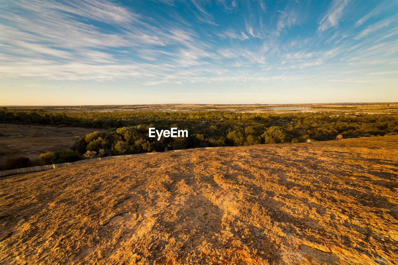 Scenic view of field against sky during sunset