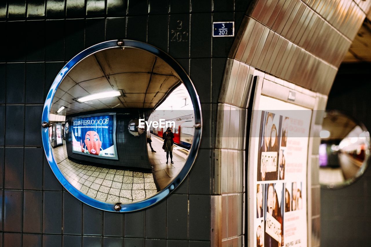 Reflection of railroad station platform on mirror