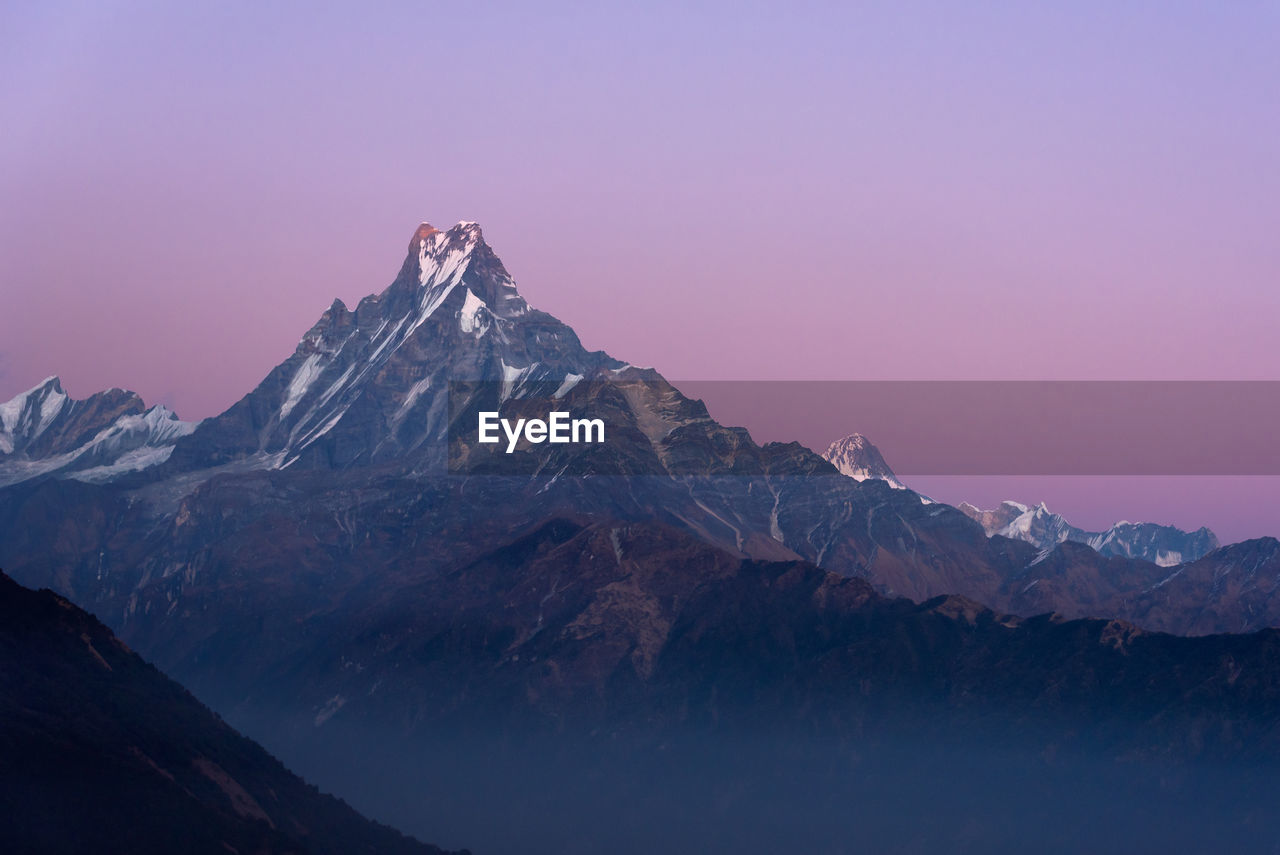 Scenic view of of himalayan mountain range against sky during sunset