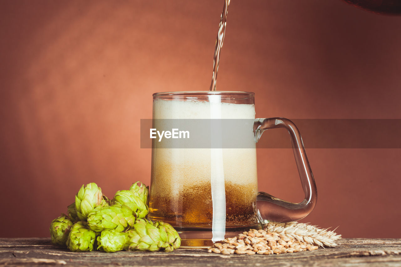 CLOSE-UP OF DRINK ON TABLE