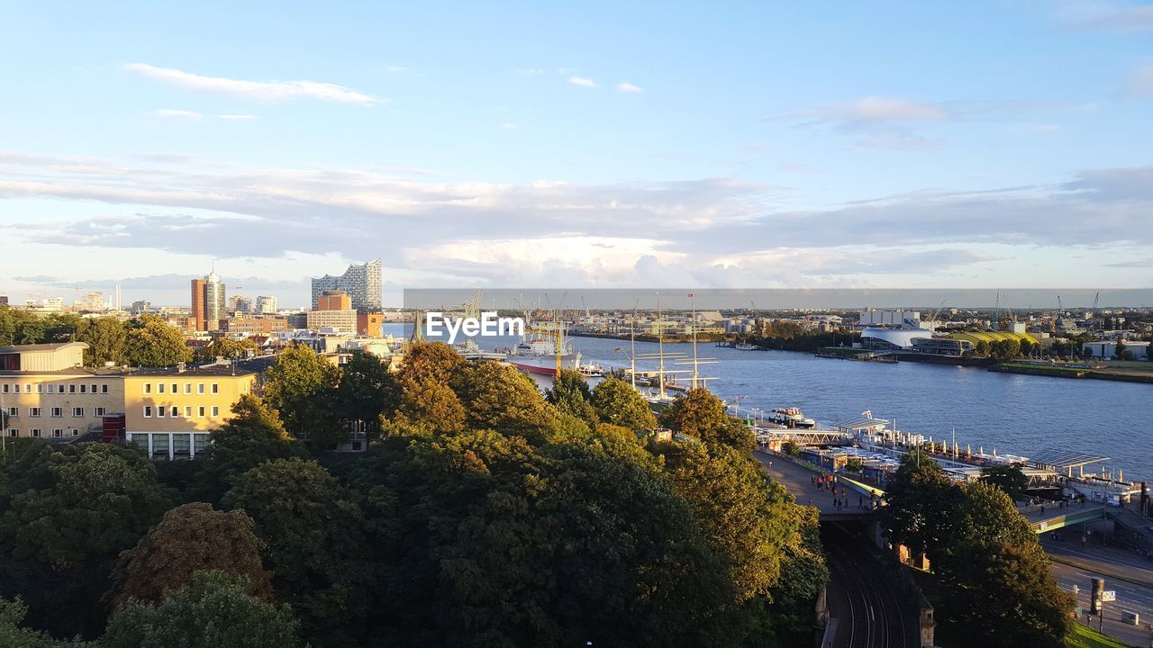 High angle view of trees and buildings against sky