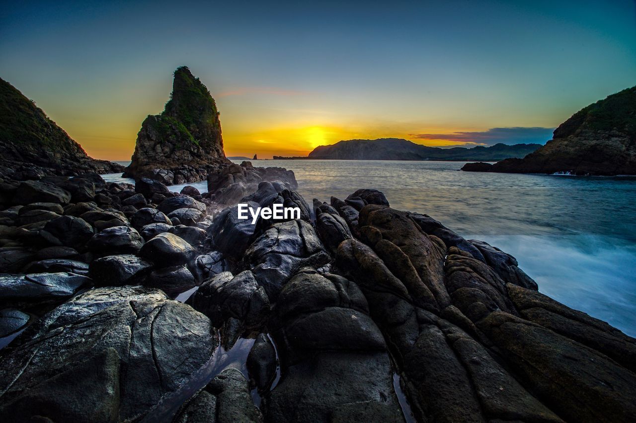 Scenic view of sea against sky during sunset