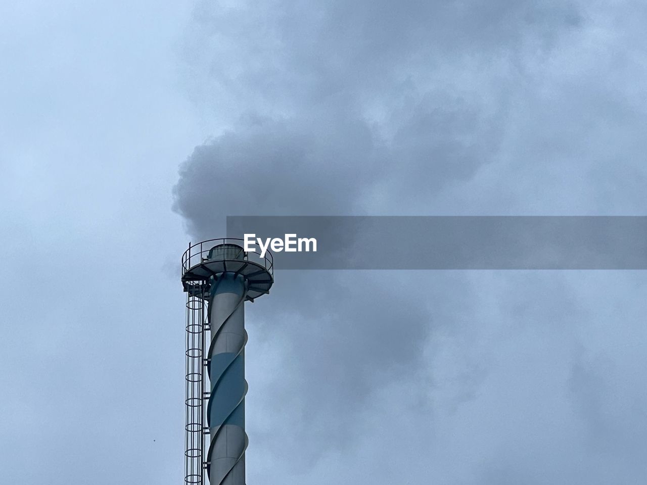 LOW ANGLE VIEW OF FACTORY AGAINST SKY