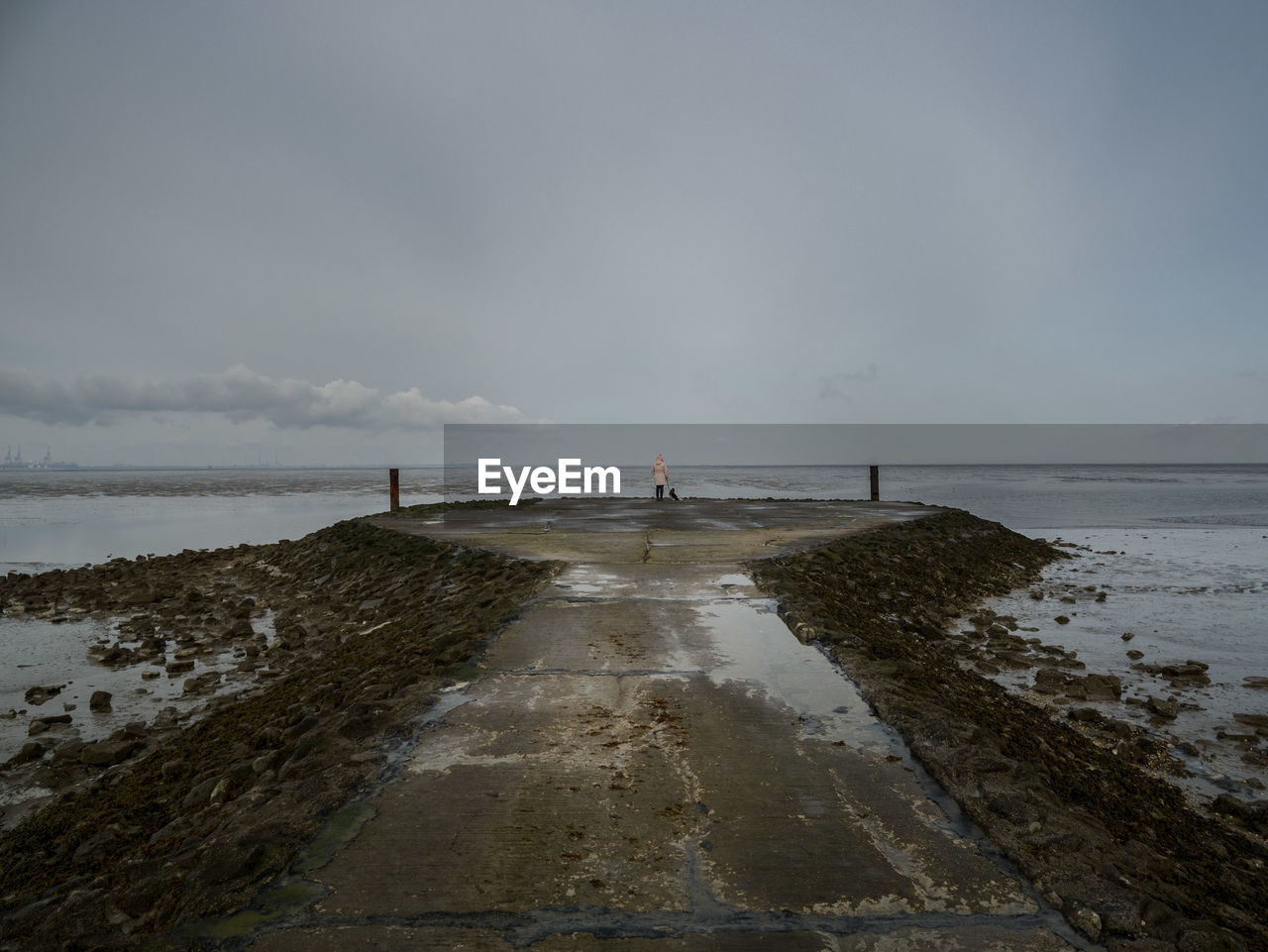 Pier over sea against sky