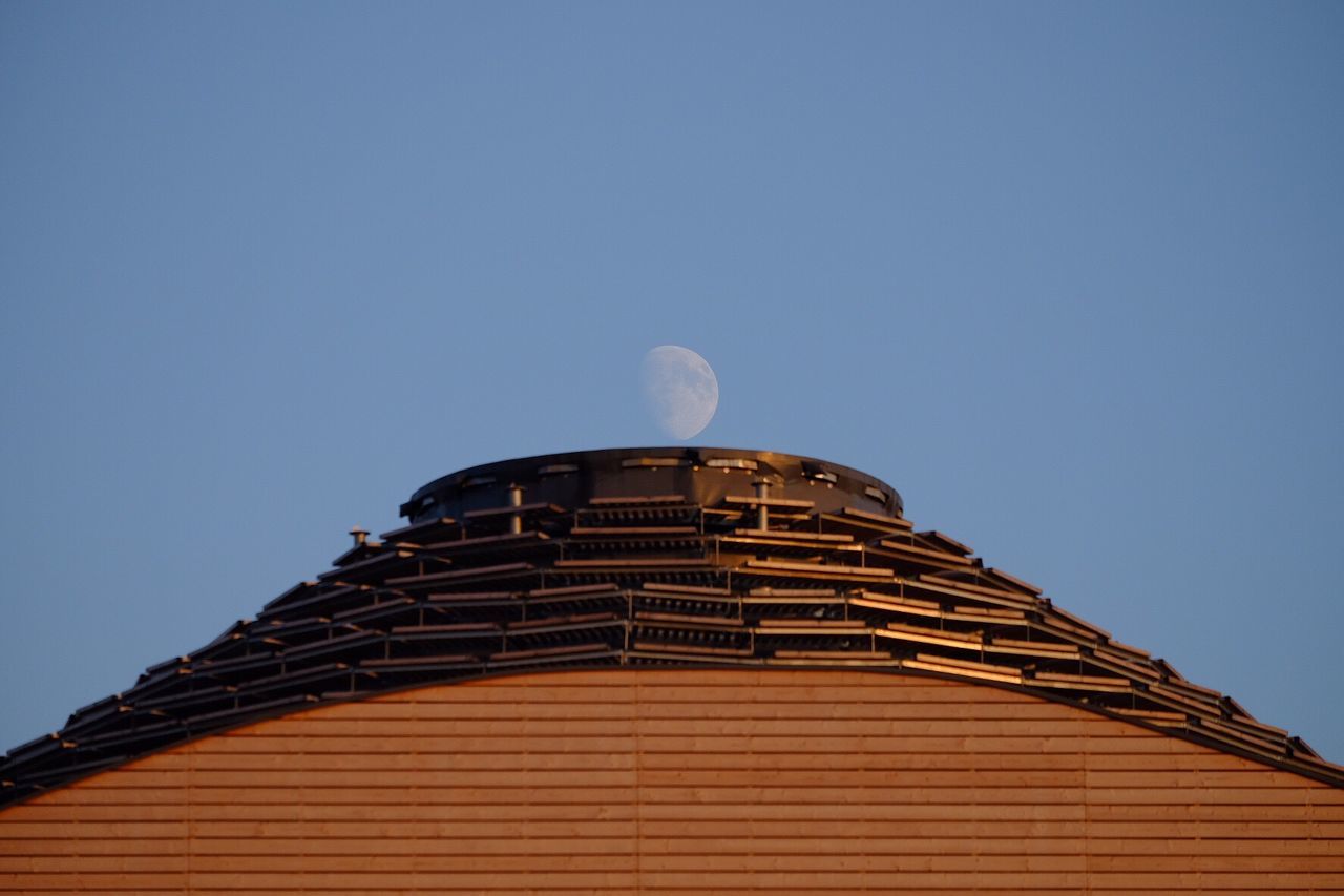 Low angle view of building against clear blue sky