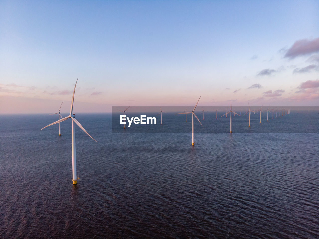 Aerial view windmill turbine scenic view of sea against sky wind mill green energy  global warming