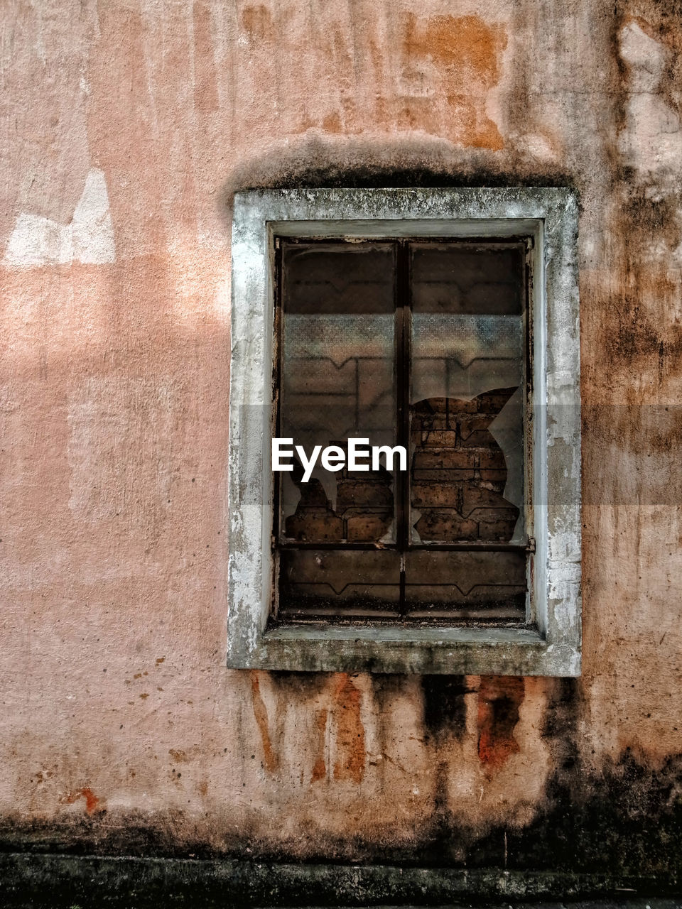 Low angle view of window on old building