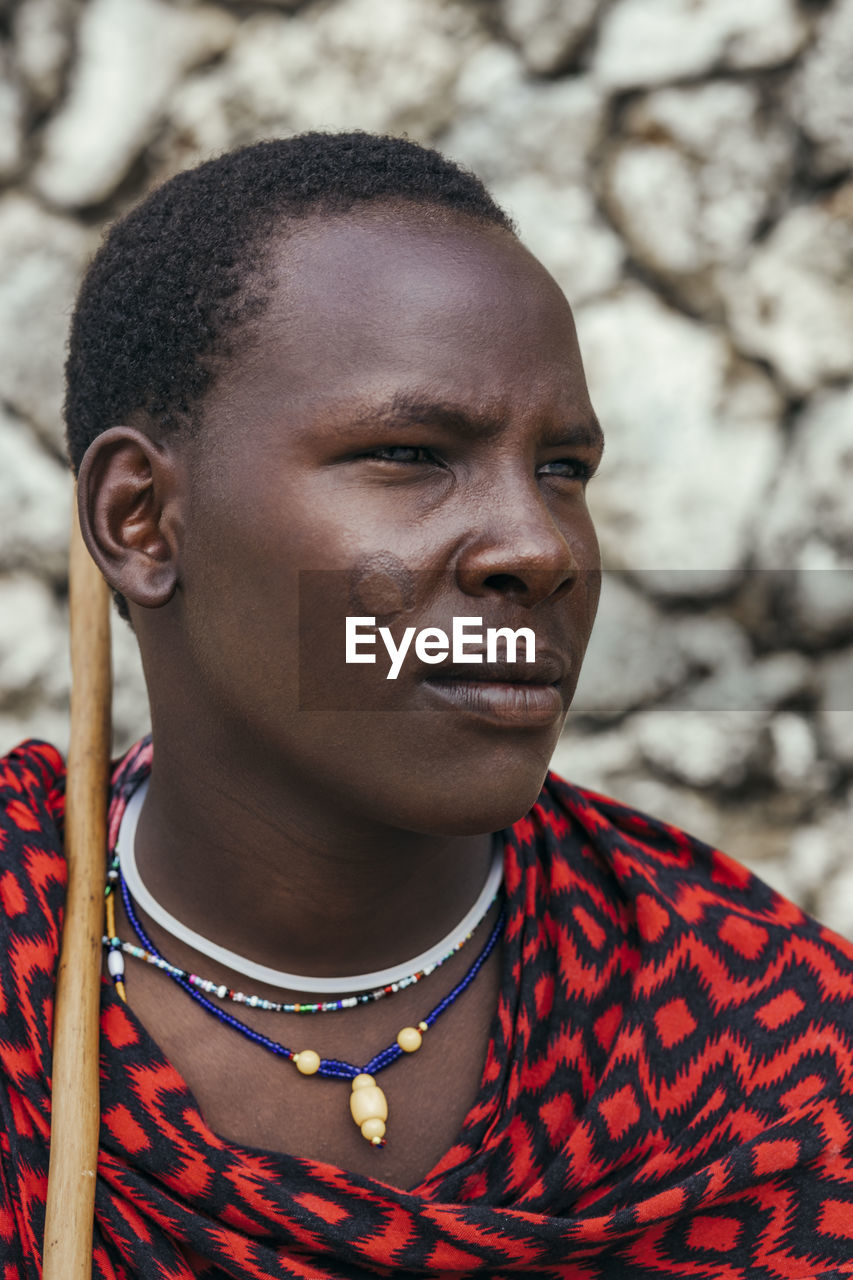 Maasai man portrait in front of the sea