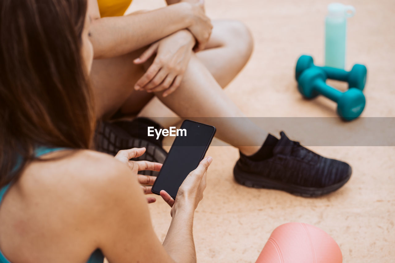 high angle view of woman doing yoga at home