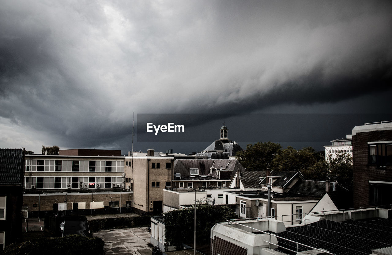 BUILDINGS IN CITY AGAINST SKY