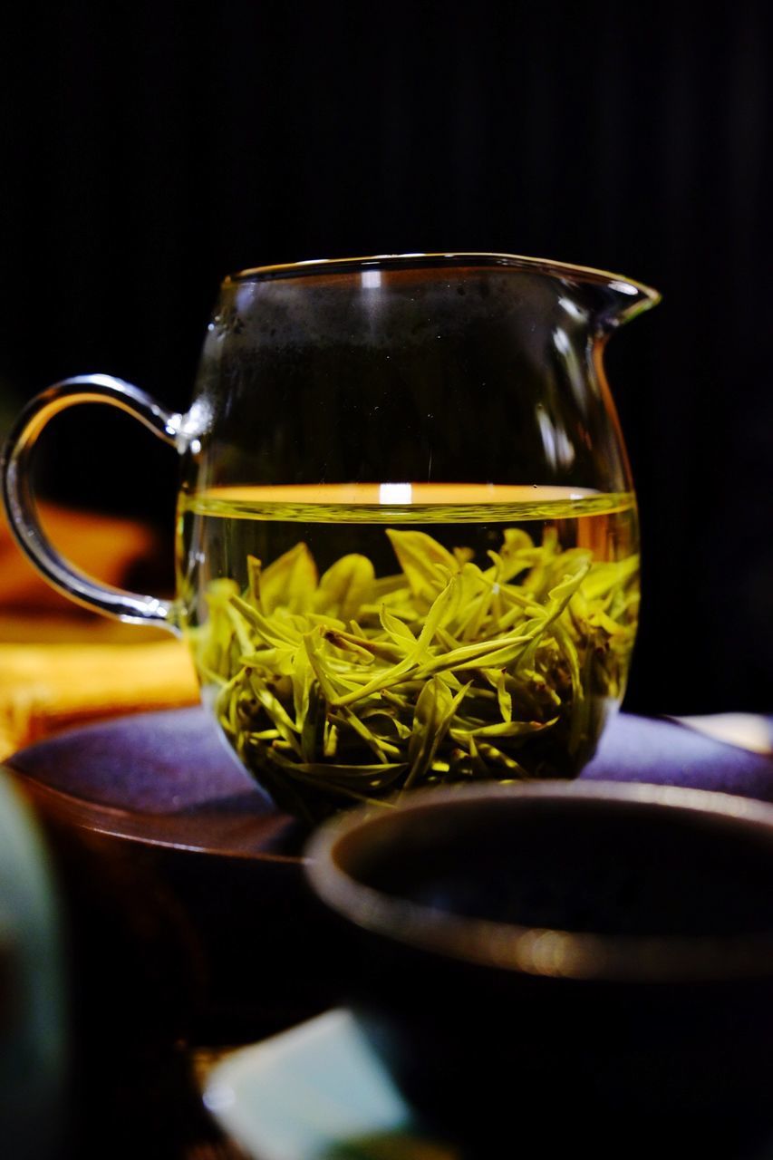 Close-up of fresh chinese tea in jug on table