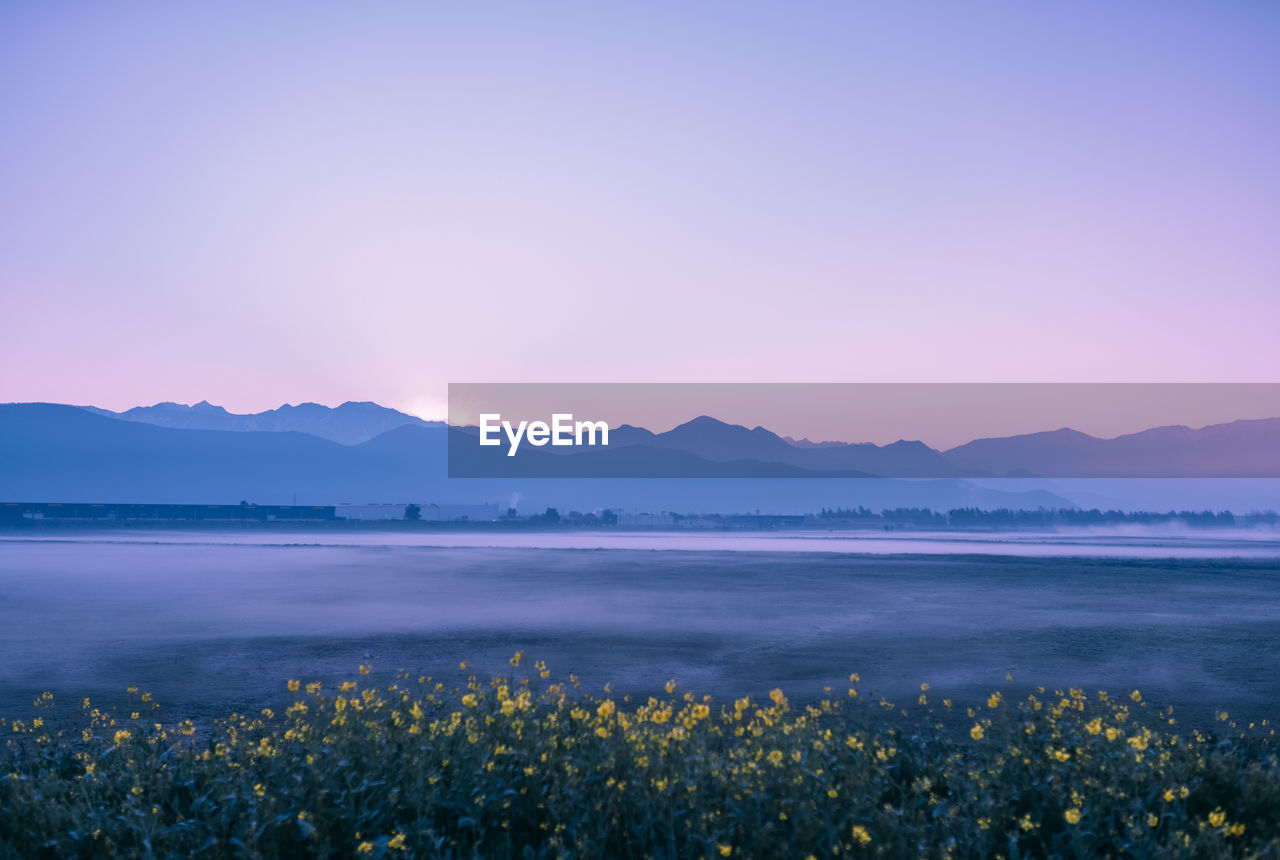 Scenic view of mountains against sky during sunset