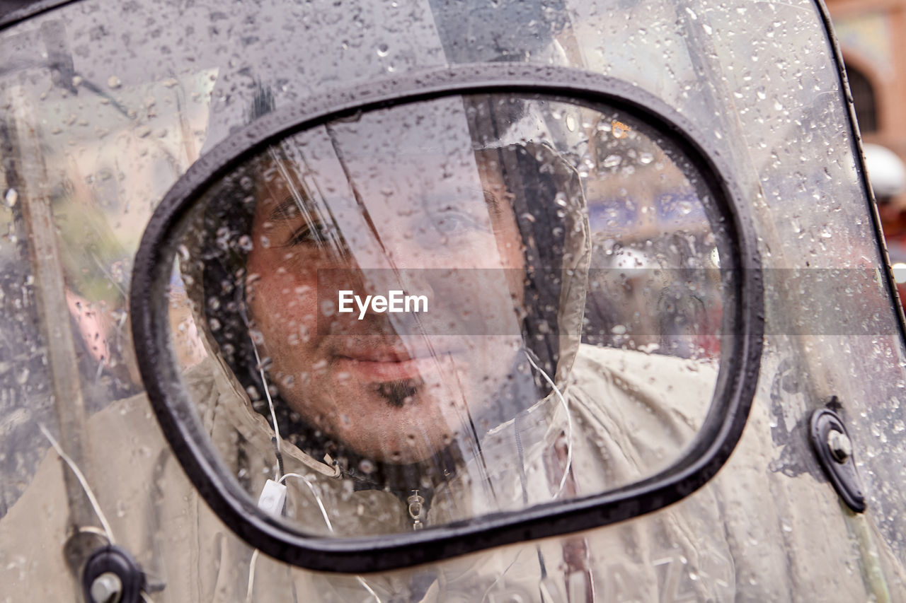 REFLECTION OF SIDE-VIEW MIRROR OF CAR