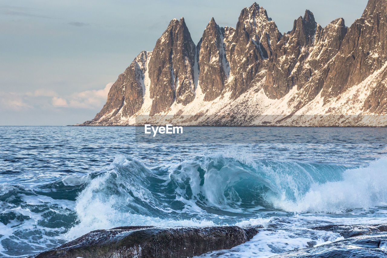 Scenic view of sea against cloudy sky