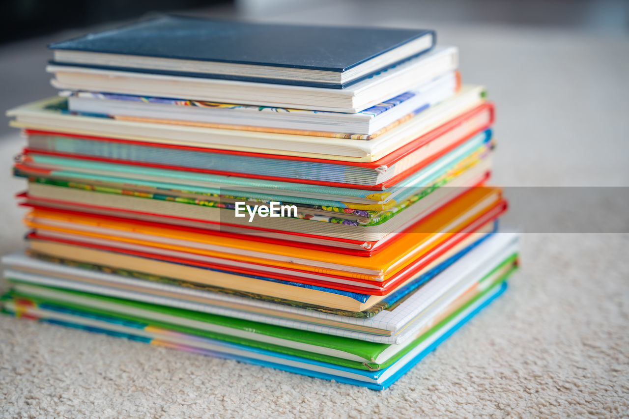 close-up of stacked books on table
