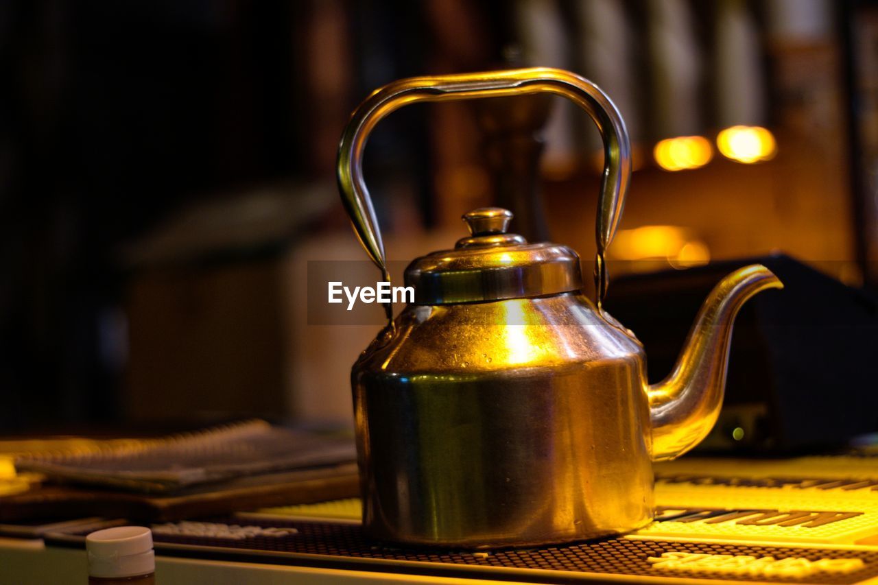 CLOSE-UP OF TEA LIGHT ON TABLE