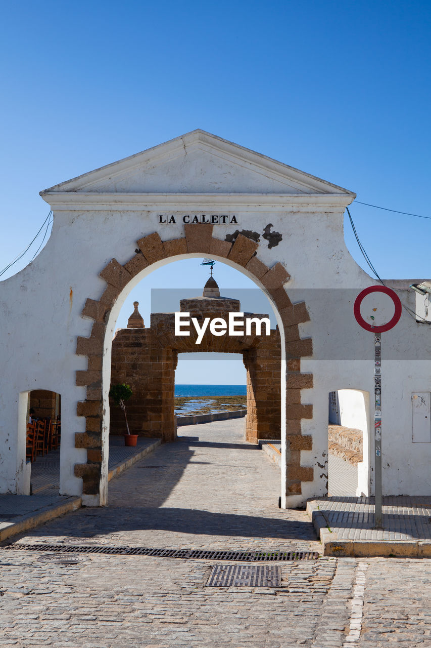 Main gate to la caleta beach and santa catalina castle, cadiz, andalusia, spain. 