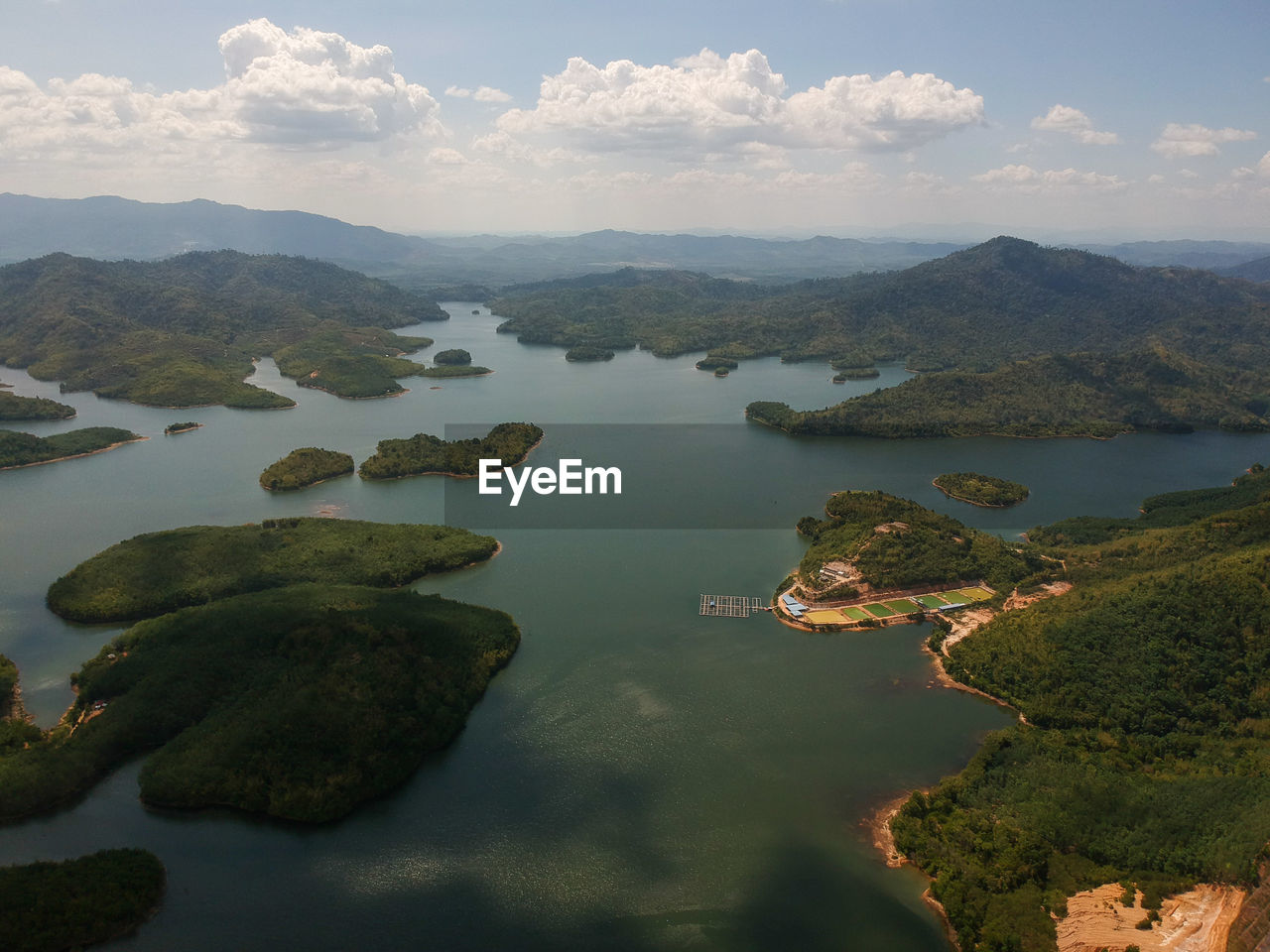 AERIAL VIEW OF LAKE AGAINST SKY