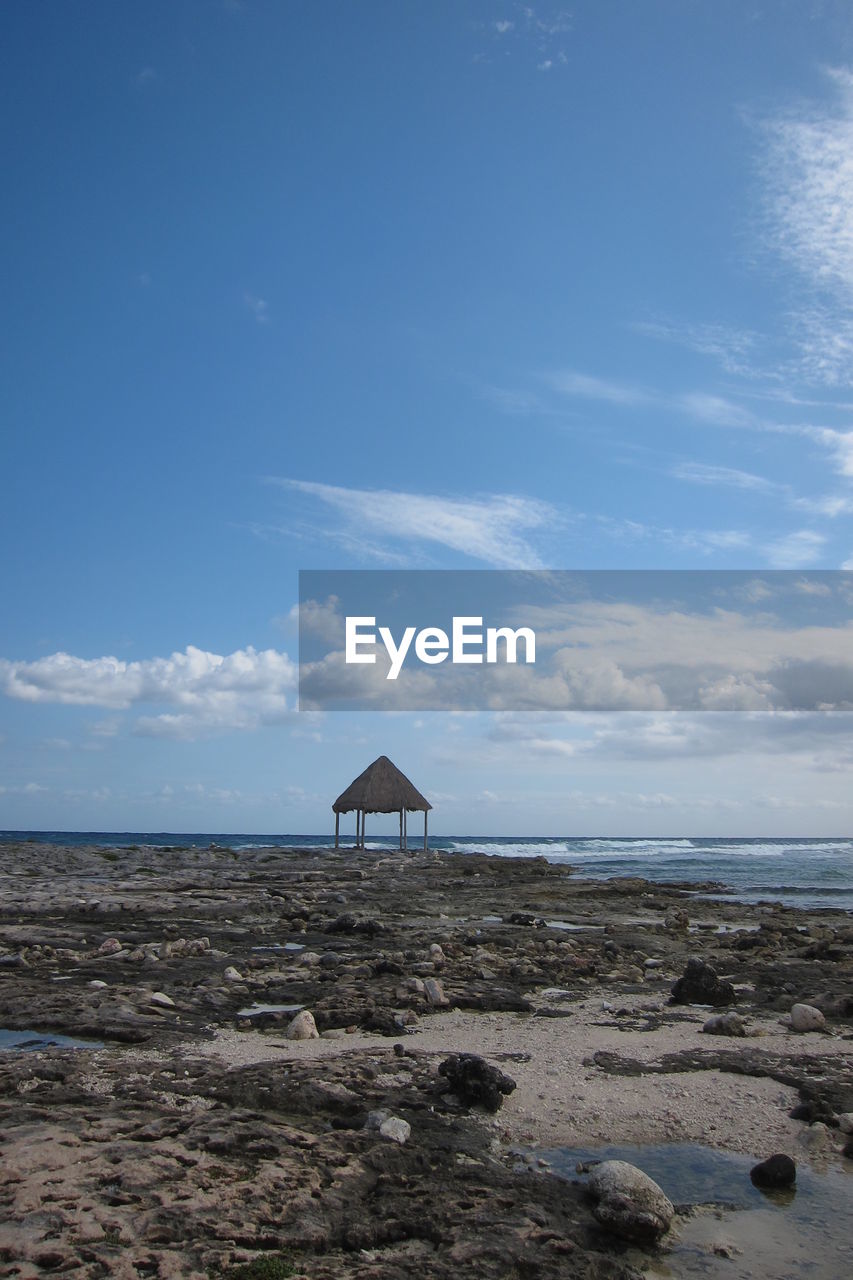 Scenic view of sea against cloudy sky