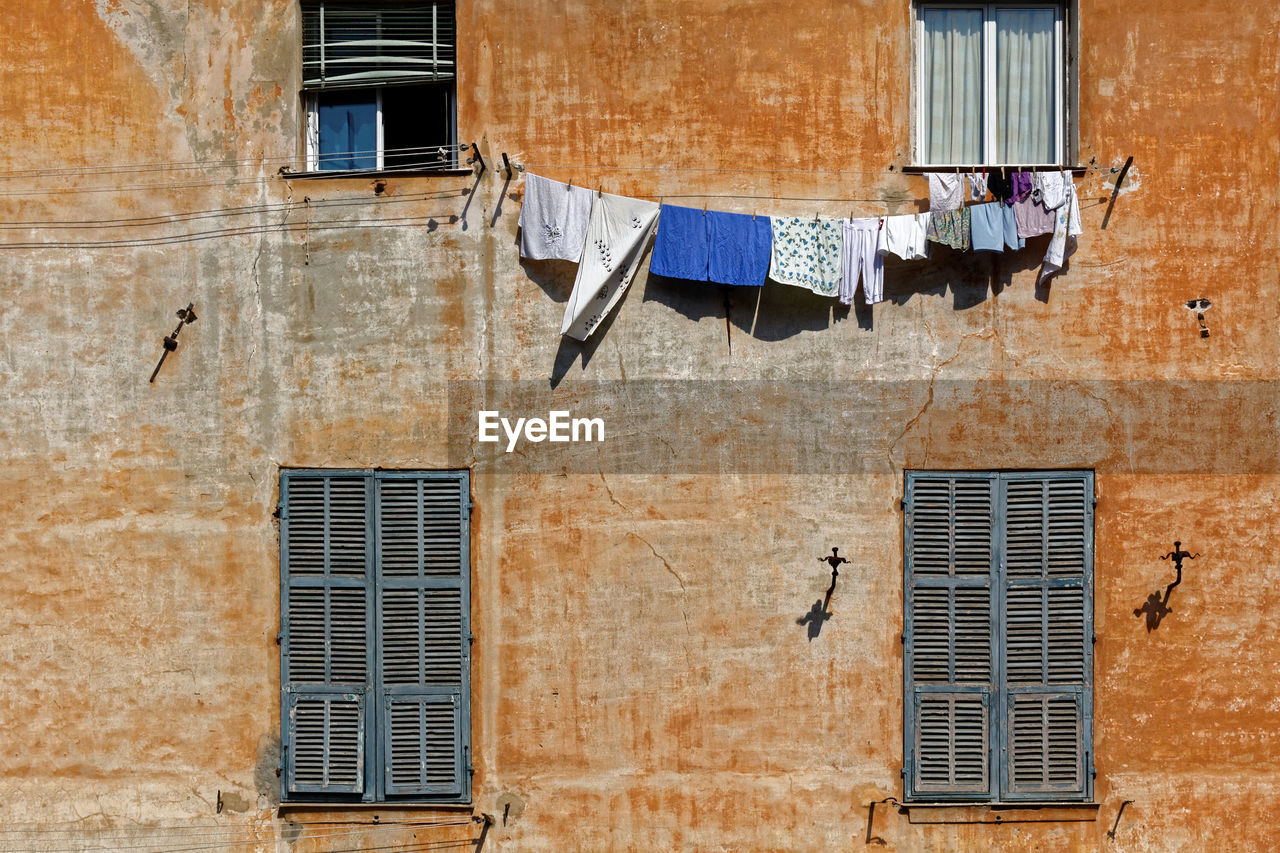 CLOTHES DRYING OUTSIDE BUILDING