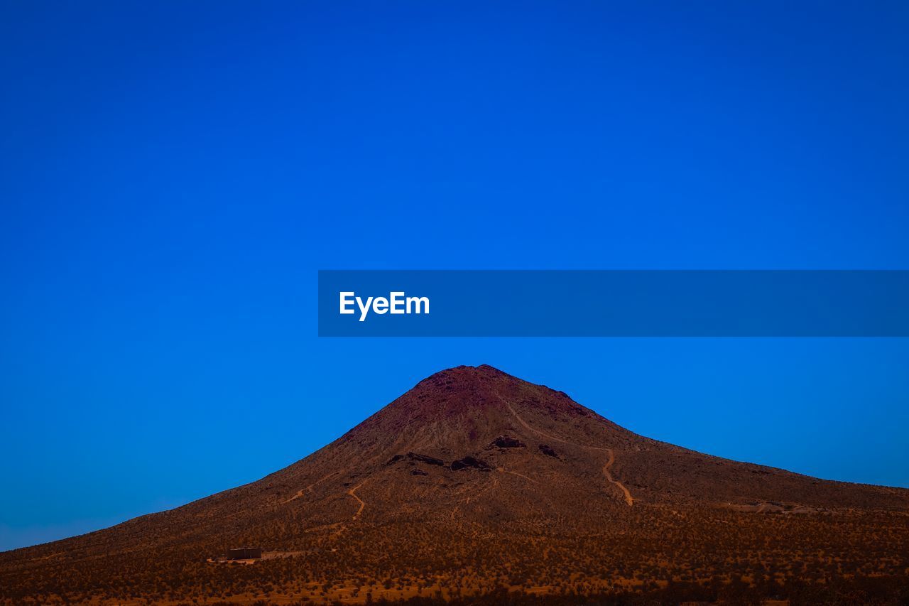 View of mountain against blue sky