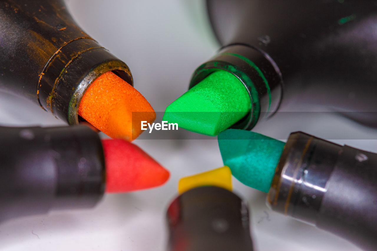 Close-up of multi colored pencils on table