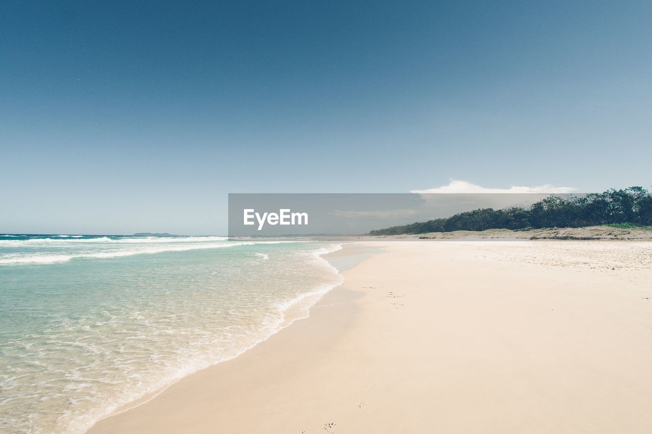 View of beach against clear sky