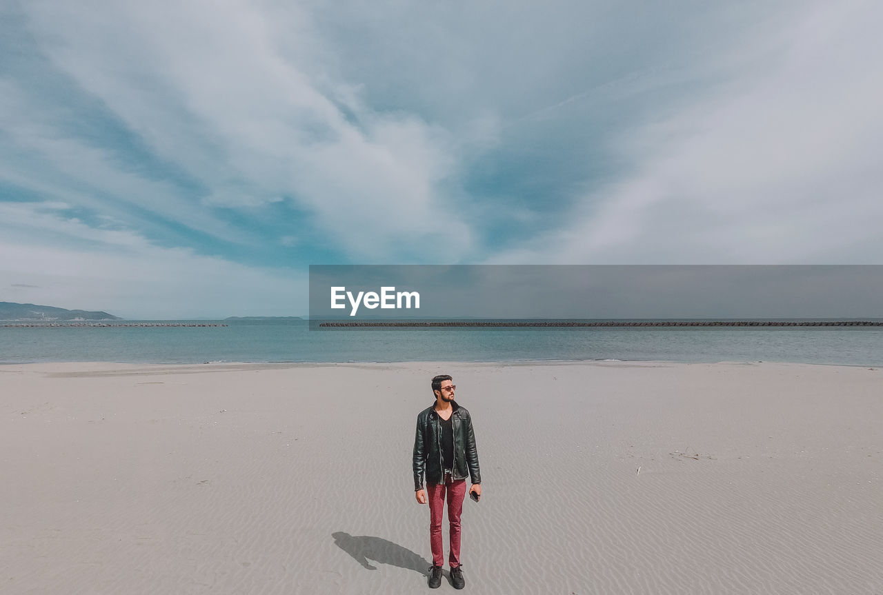 Full length of man standing at beach