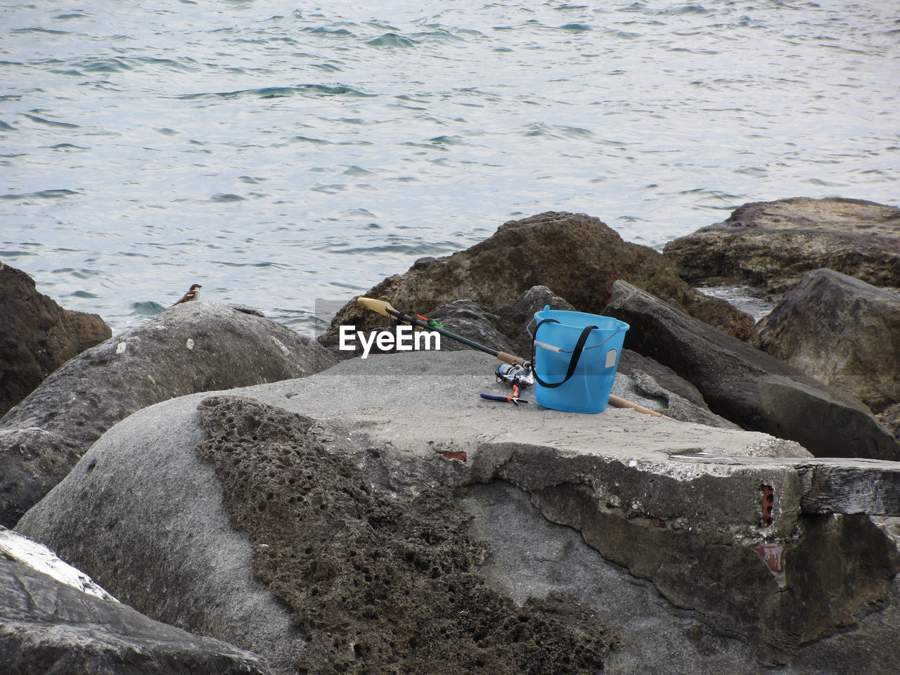 Fishing gear on the rock by the sea