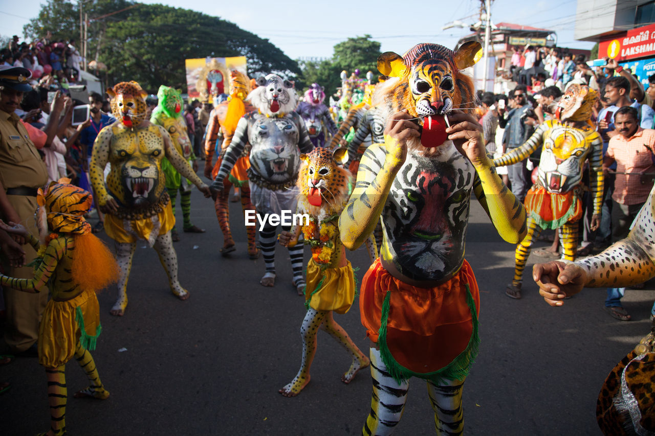 PANORAMIC VIEW OF PEOPLE AT STREET