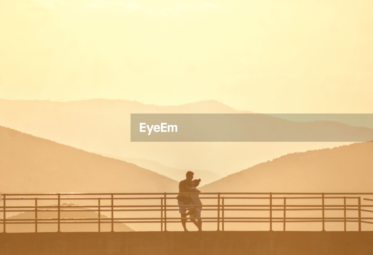 A romantic scenic view of mountains against sky