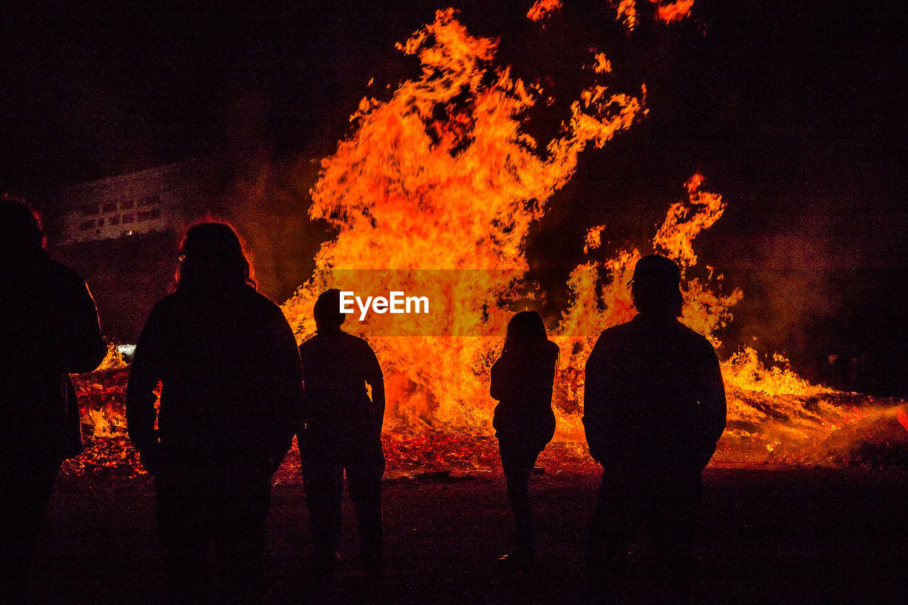 Silhouette of people at night