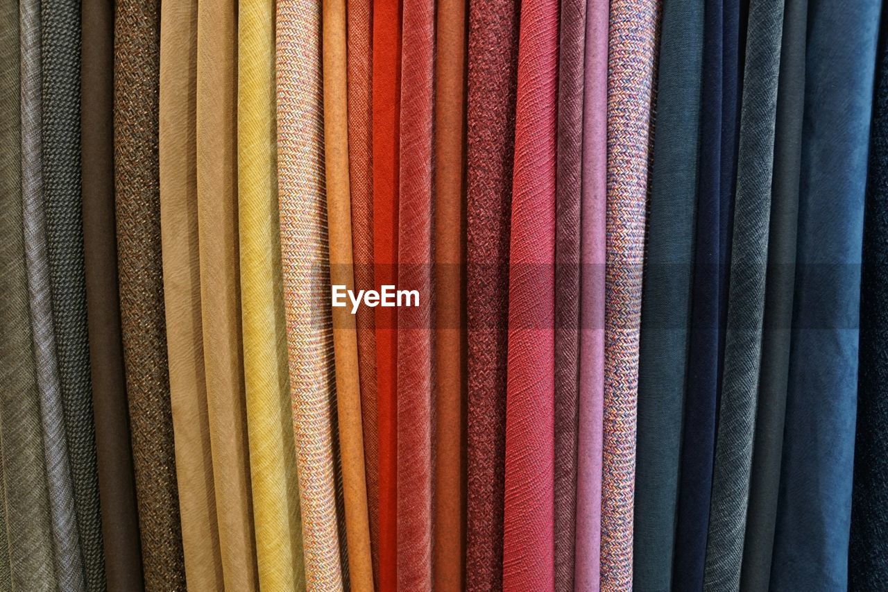 FULL FRAME SHOT OF MULTI COLORED FABRIC AT MARKET