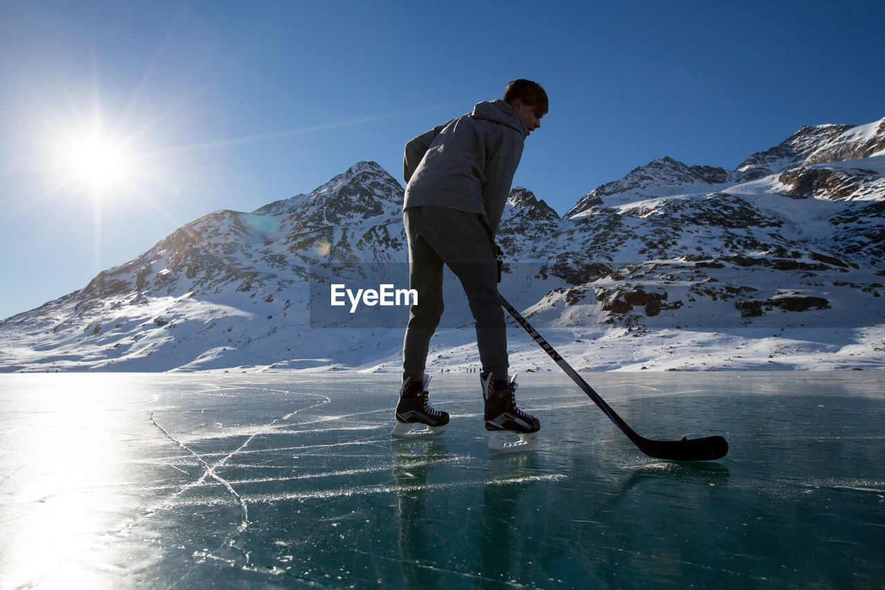 Young man playing ice hockey