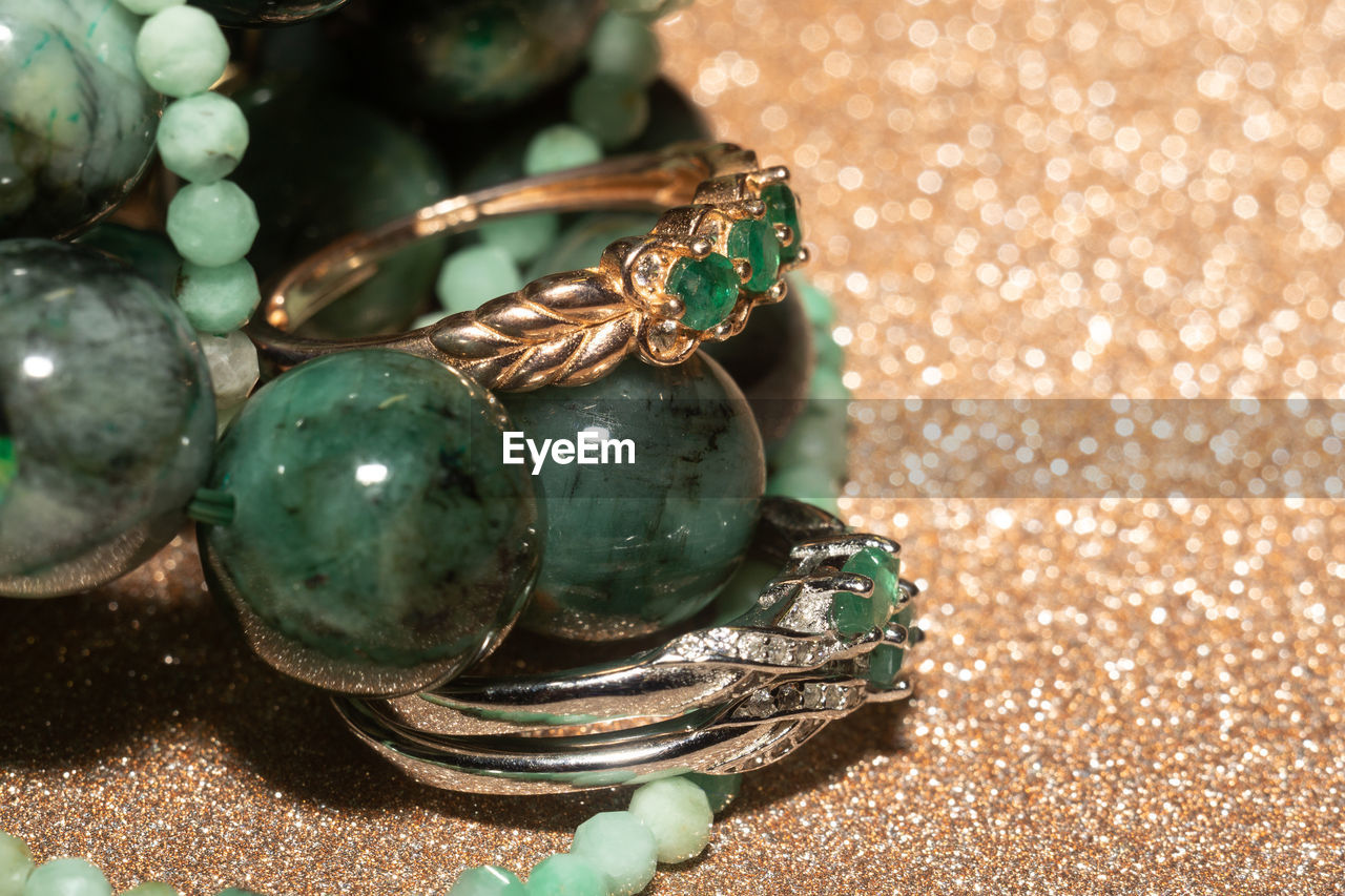 Natural emerald, beryl beaded bracelet, necklace and yellow gold ring.