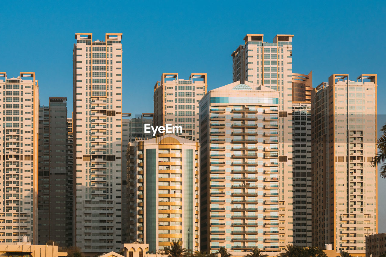 skyscrapers in city against clear sky