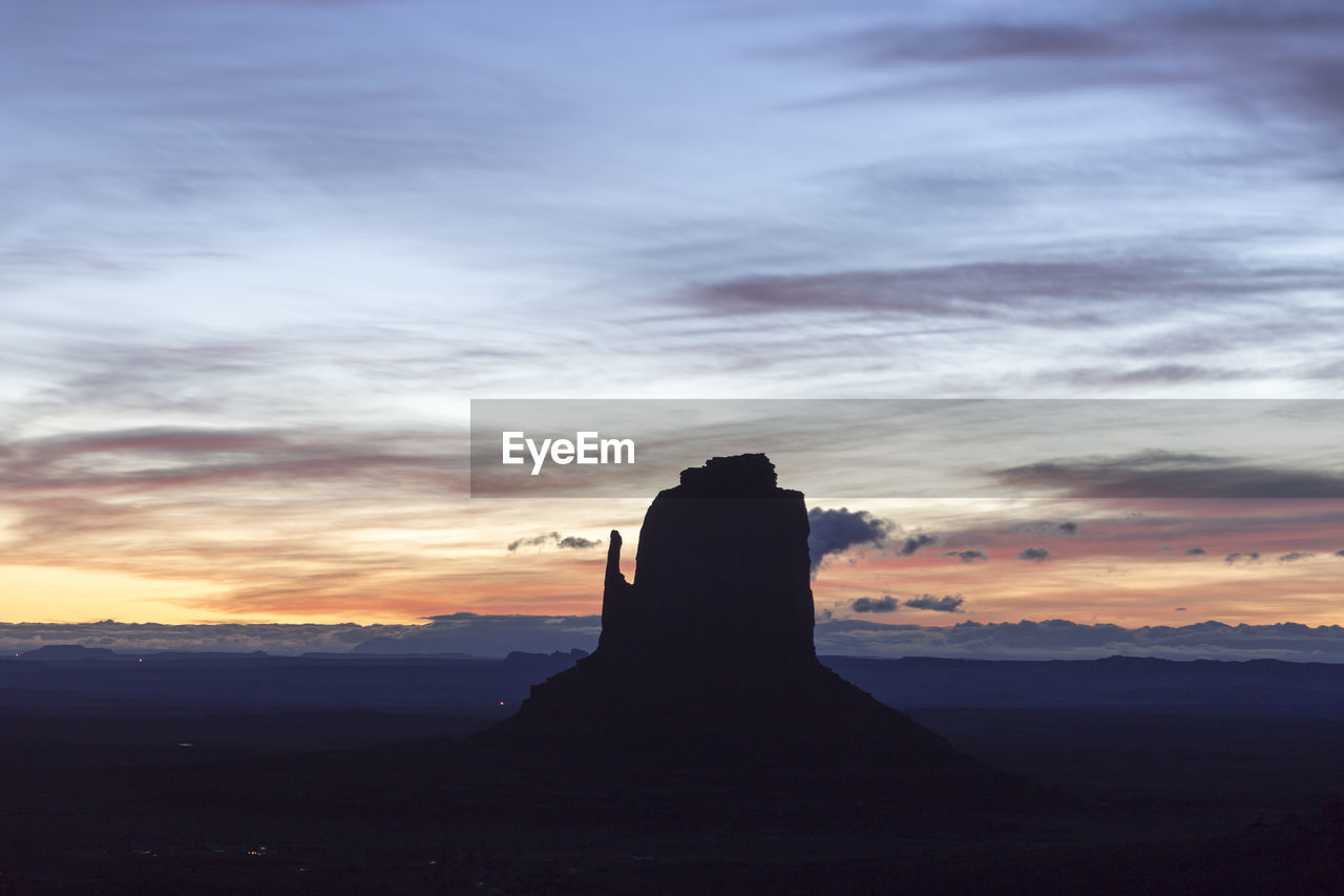 The east mitten butte in monument valley navajo tribal park at sunrise against a colourful sky 