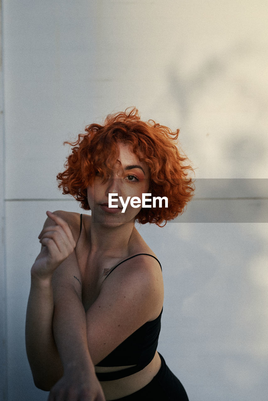 Young alternative redhead girl's portrait at sunset