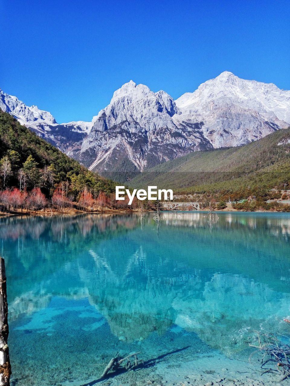 Scenic view of mountain reflected in lake