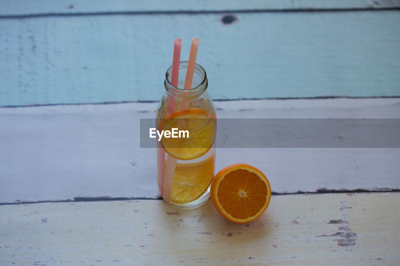 CLOSE-UP OF DRINK IN CUP ON TABLE